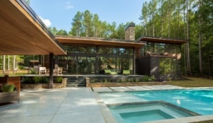 A large pool with a deck and patio area.