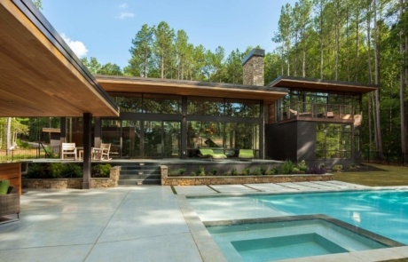 A large pool with a deck and patio area.