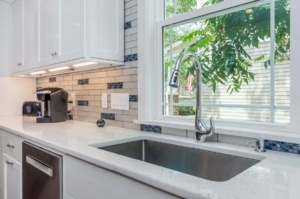 A kitchen with a sink and window in it