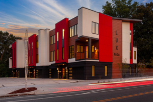 A building with red and white accents on the side of it.