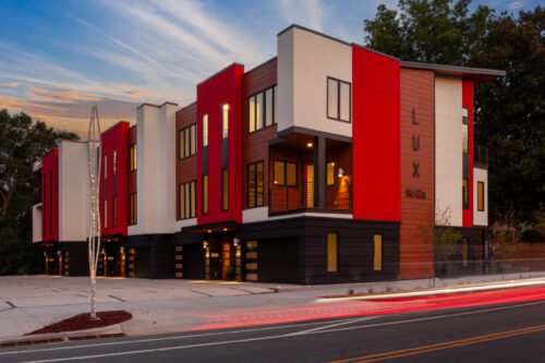 A building with red and white accents on the side of it.