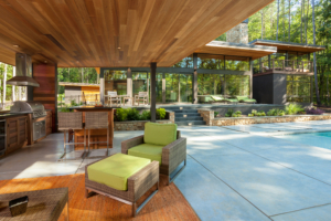A patio with chairs and tables in the background.