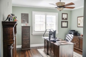 A room with a desk and chair in it