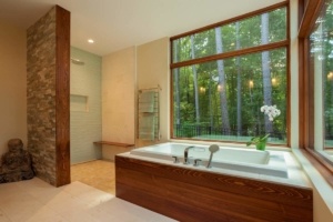 A large bathroom with a tub and shower.