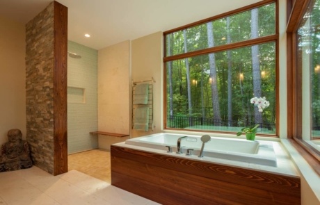 A large bathroom with a tub and shower.