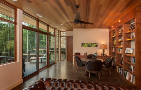 A living room with wooden floors and walls