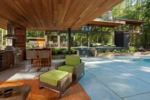 A patio with chairs and tables in it
