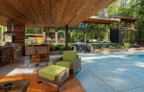 A patio with chairs and tables in it