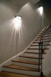 A staircase with a light hanging from the top of it.