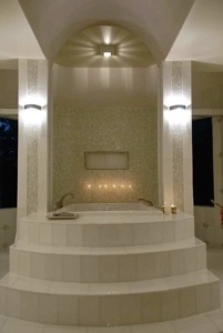 A large white tub sitting in the middle of a room.
