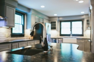 A kitchen with a sink and counter top
