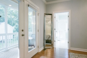 A room with two doors and a mirror