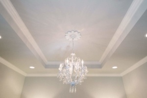 A chandelier in the middle of a room.