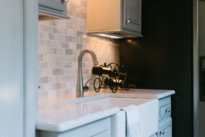 A kitchen with a sink and a stove