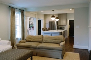 A living room with a couch and chairs in it