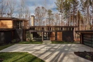 A house with a lot of trees in the background