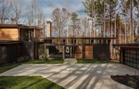 A house with a lot of trees in the background