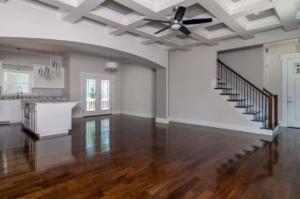 A large open floor plan with wood floors and ceiling.