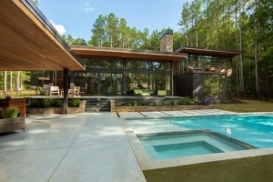 A pool with a hot tub in the middle of it