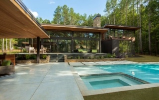 A pool with a hot tub in the middle of it