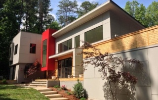 A house with steps leading to the front door.