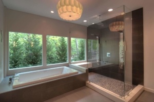 A large bathroom with a tub and shower.