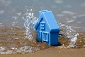 A blue toy house in the water.