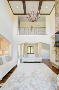 A living room with two couches and a fireplace.