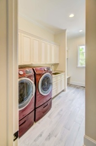 A view of two washing machines in the laundry room.