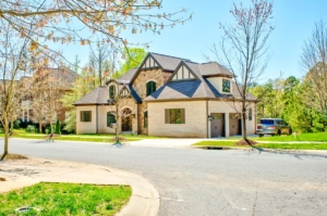 A large house with a driveway in front of it.
