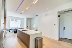 A kitchen with a large island in the middle of it