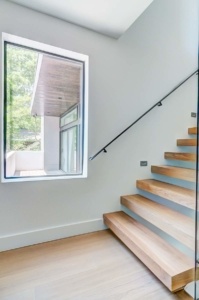 A window is seen through the stairs.