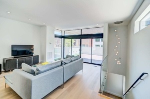 A living room with a couch and a window