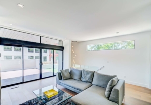 A living room with a couch and table
