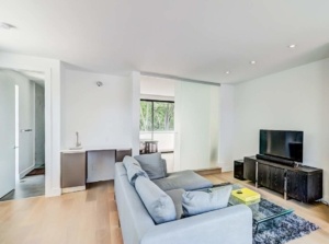 A living room with a couch and television in it