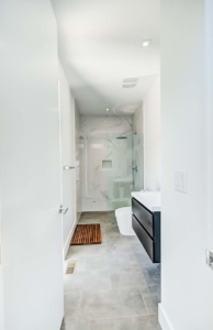 A bathroom with a toilet and shower in it