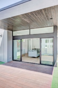 A large sliding glass door in the middle of a room.