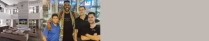 Two men posing for a picture in front of a store.