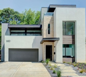 A modern style home with a garage door.