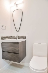 A bathroom with a sink and toilet in it