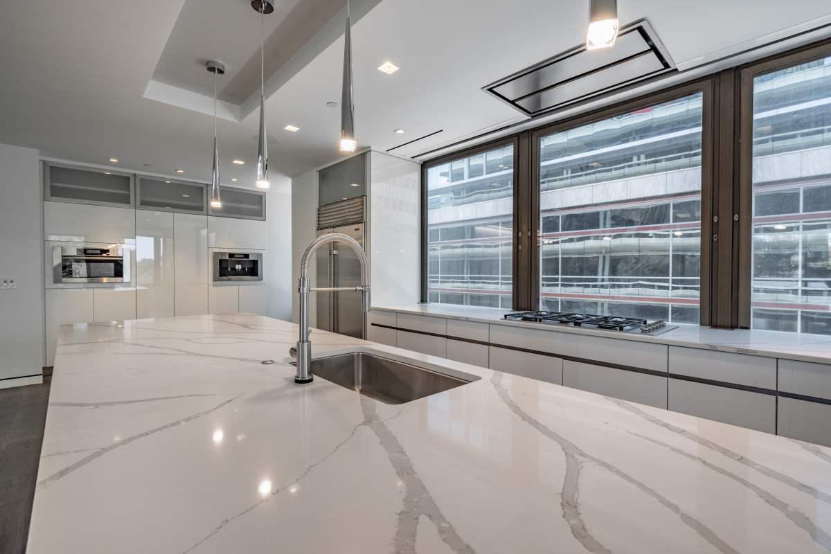 A kitchen with a sink and a window