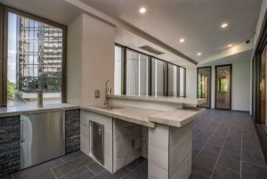 A kitchen with a sink and counter in it