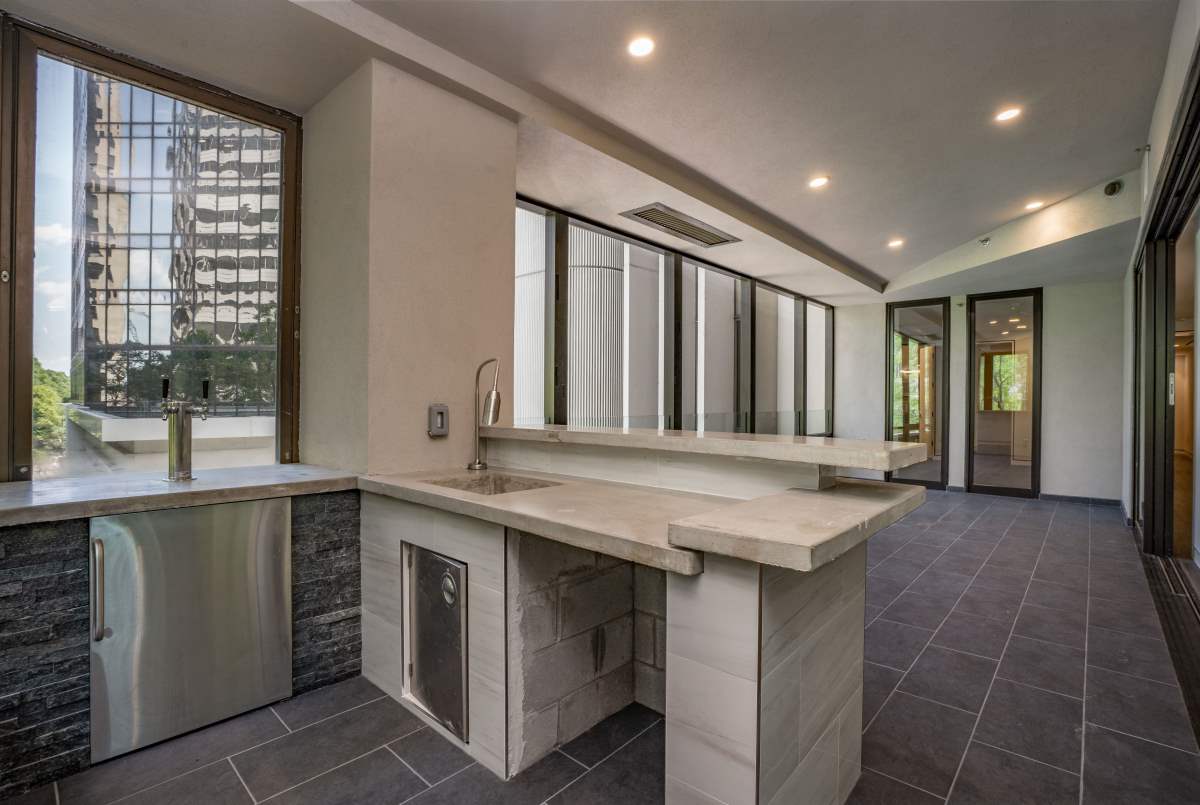 A kitchen with a sink and counter in it