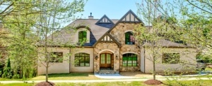 A large house with a lot of windows and doors