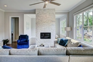 A living room with a fireplace and couches