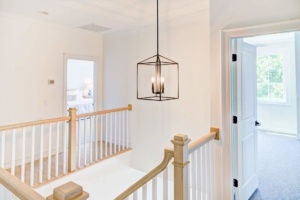 A light hanging from the ceiling of a room.