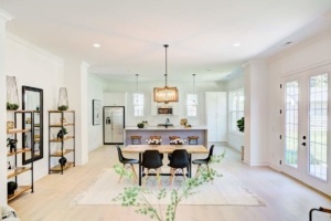 A dining room with a table and chairs in it