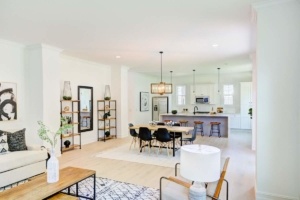 A living room with a dining table and chairs