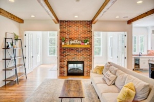 A living room with a couch and fireplace