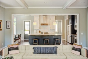 A living room with a couch and chairs in it